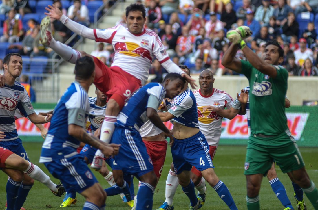Red Bulls striker Fabian Espindola elevates over several players during second half action.